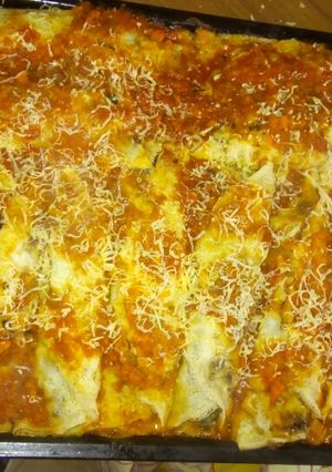 Una foto de Canelones de acelga y queso