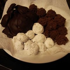A picture of A trio of temptations: bonbons and creams.