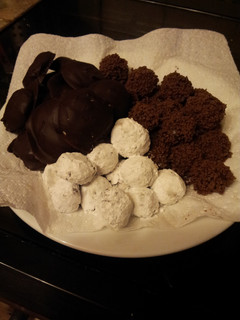 A picture of A trio of temptations: bonbons and creams.