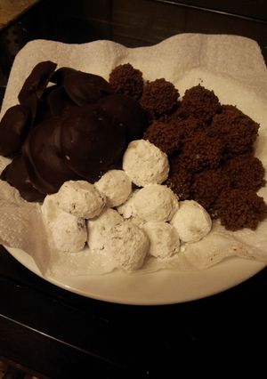 A picture of A trio of temptations: bonbons and creams.