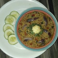 A picture of Indomie peppersoup and boiled egg.