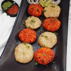 A picture of Tandoori and Steamed Chicken Momos Recipe with Chutney's.