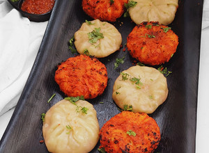 A picture of Tandoori and Steamed Chicken Momos Recipe with Chutney's.