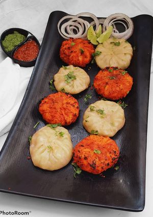 A picture of Tandoori and Steamed Chicken Momos Recipe with Chutney's.