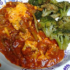 A picture of Asparagus, Tomatoes, with Meatballs.