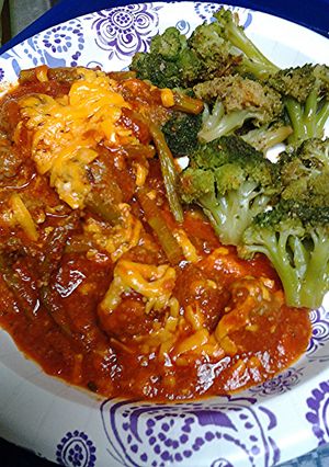 A picture of Asparagus, Tomatoes, with Meatballs.