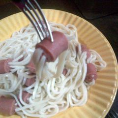 A picture of sausage with noodles.
