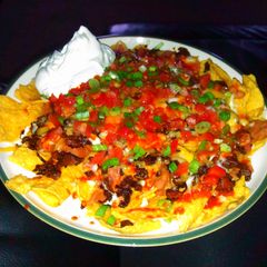 A picture of Carne asada nachos, cantina style.