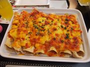 A picture of sour cream and cheese enchiladas