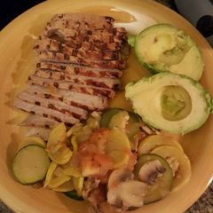 A picture of Marinated Pork Chops and Cooked Vegetables..
