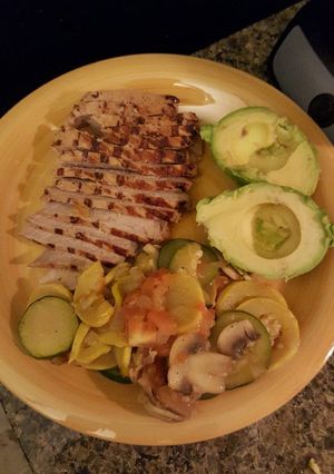 A picture of Marinated Pork Chops and Cooked Vegetables..