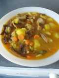 Patatas con costilla de cerdo y níscalos