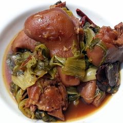 A picture of Mustard Green And Ham Hock Stew.