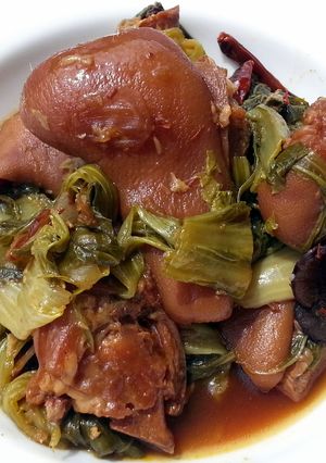 A picture of Mustard Green And Ham Hock Stew.