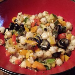 A picture of Hominy with Peppers and Zucchini.