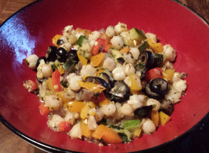 A picture of Hominy with Peppers and Zucchini.