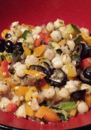 A picture of Hominy with Peppers and Zucchini.