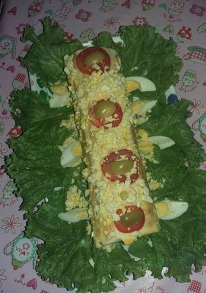 Una foto de Pionono de pollo, jamón y queso