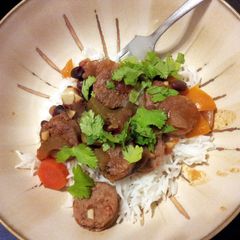 A picture of Chicken and pork sausage and beans..