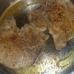 A picture of Seared stove top porkchops.