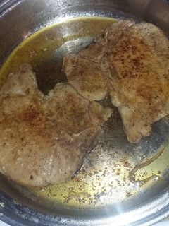 A picture of Seared stove top porkchops.