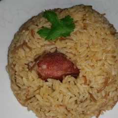 Una foto de Locrio de fideos y chuleta