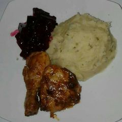 A picture of Grilled chicken with mashed potatoes.