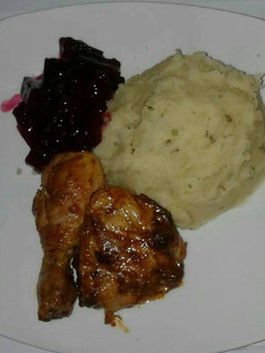 A picture of Grilled chicken with mashed potatoes.