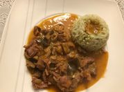 Una foto de mollejas de pollo en salsa