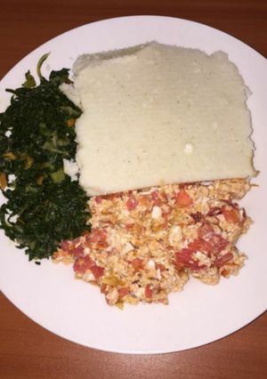 A picture of Ugali,Scrambled eggs and Steamed Spinach.