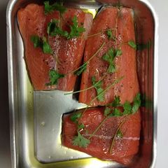 A picture of Baked salmon with sticky rice and roasted broccoli..