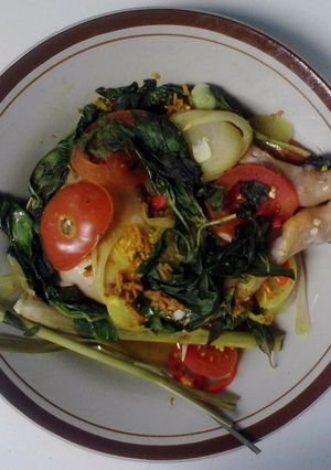 A picture of spiced chicken with basil.