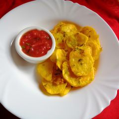 Potatoes bhajia with tomato-mango salsa dip A picture of Potatoes bhajia with tomato-mango salsa dip.