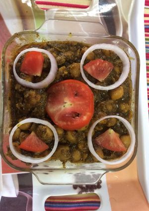 A picture of Palak chole yummy with poori and bhtura.