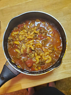 A picture of Tomato pasta soup with beef.
