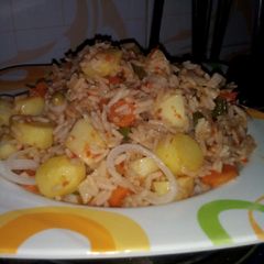 A picture of Jollof rice with potato.