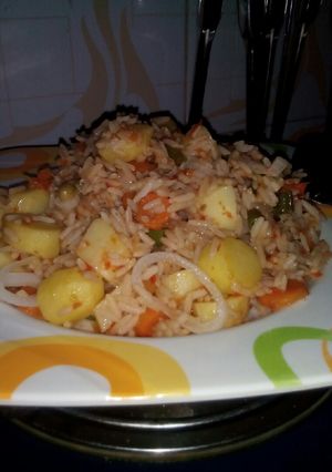 A picture of Jollof rice with potato.