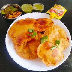A picture of Makka masala Aloo Puri (Maize flour poori 😋 makki ke aata Puri).