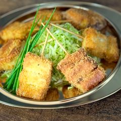 A picture of Japanese Kushiage (deep fried Japanese Leek skewers).