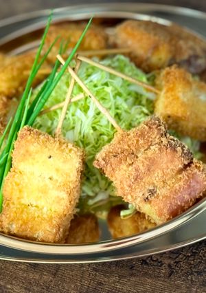 A picture of Japanese Kushiage (deep fried Japanese Leek skewers).