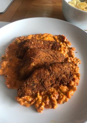 A picture of Cajun chicken with Chorizo cream & garlic sautéed potatoes.