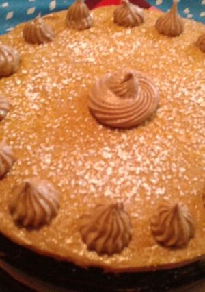 A picture of Chocolate cake with chocolate cream cheese frosting and toffee.