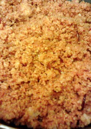 A picture of Cous cous with red pesto.