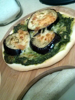 A picture of eggplant pesto pizza.