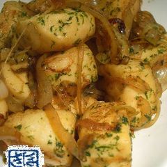 A picture of Sautéed Hanpen Seasoned with Mentsuyu and Ao-nori Seaweed.