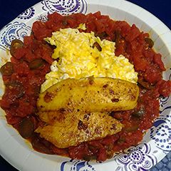 Spicy tomatoes with eggs and tilapia A picture of Spicy tomatoes with eggs and tilapia.