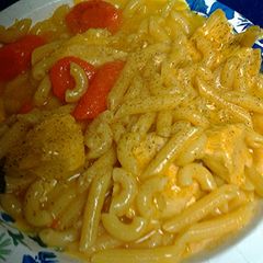 A picture of pasta chicken and carrots.