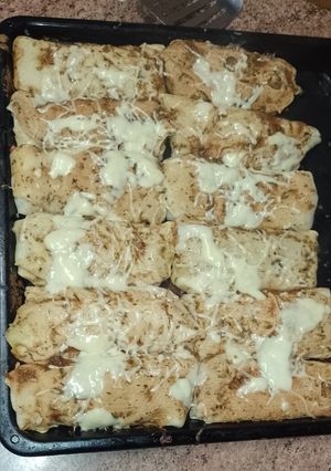 Una foto de Canelones de arroz y carne