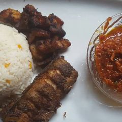 A picture of Rice with turkey and tomato sauce.