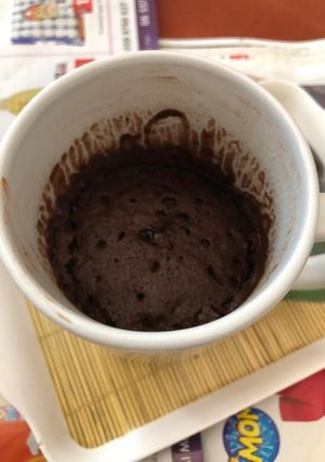 A picture of Chocolate cake in a mug.